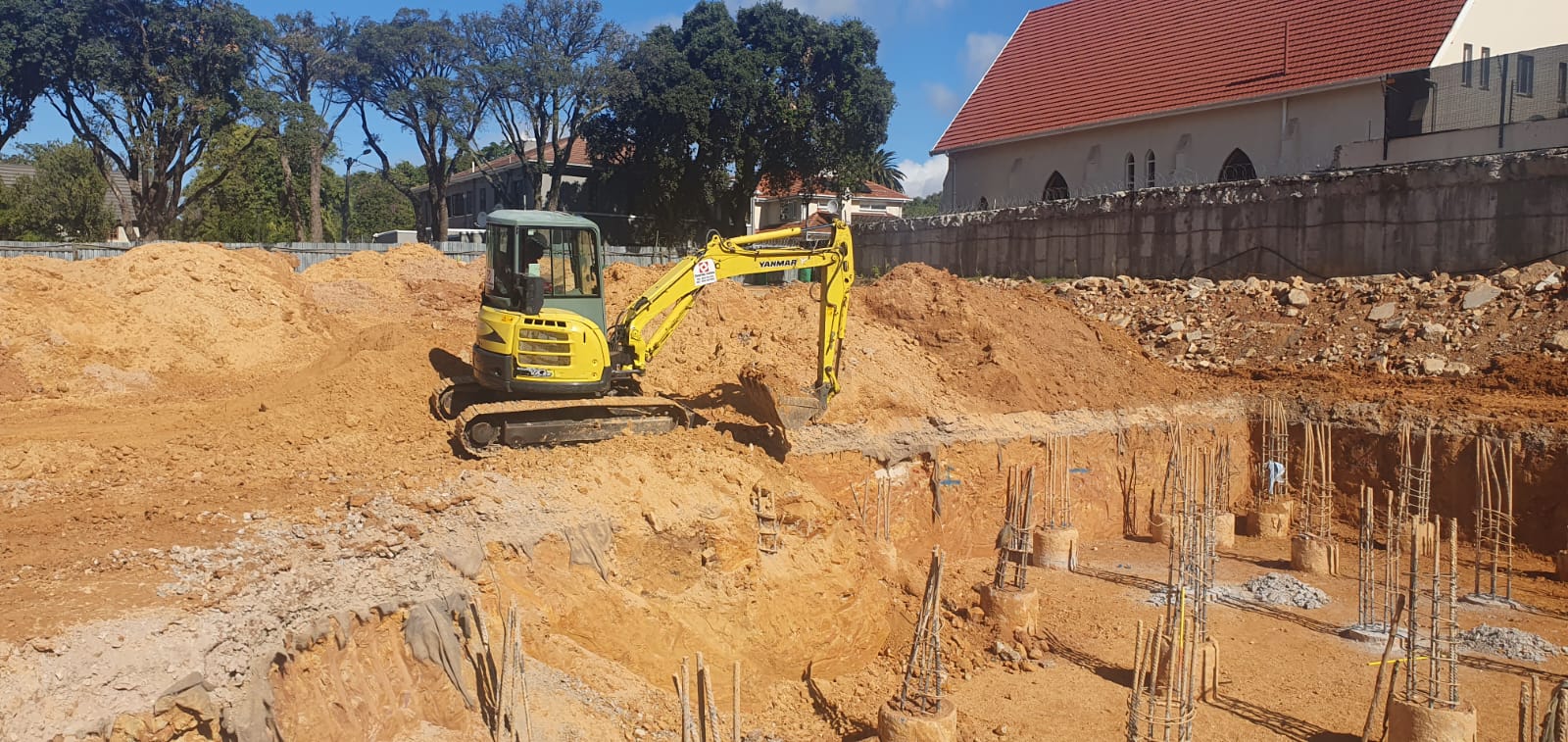 CCS mini excavator preparing a deep foundation excavation