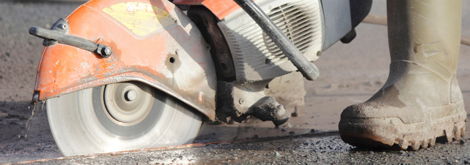 Concrete floor saw cutting a clean line through a slab